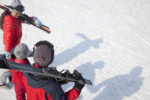 Family with Ski Gear, Walking On the Snow