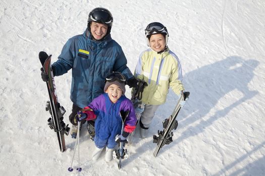 Smiling Family with Ski Gear in Ski Resort