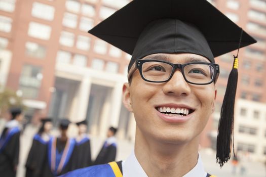 Young Graduate with Glasses Smiling, Portrait 