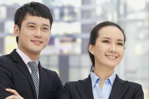 Young business man and woman, portrait 