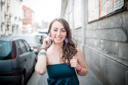 beautiful woman on the phone in the city