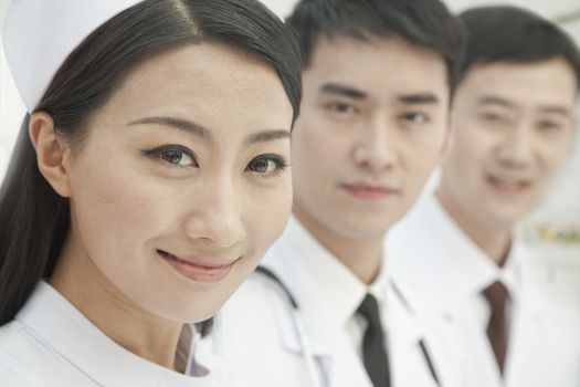 Healthcare workers standing in a row, China, Close-up