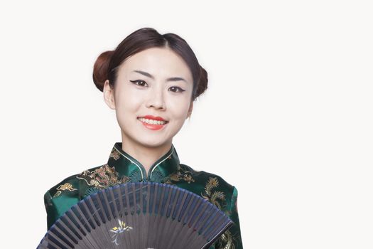 Young Woman in Qipao with Fan