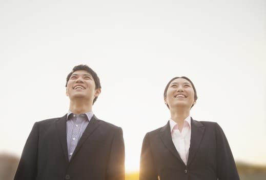 Young business people smiling