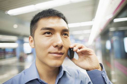 Young man talking on the phone, portrait 