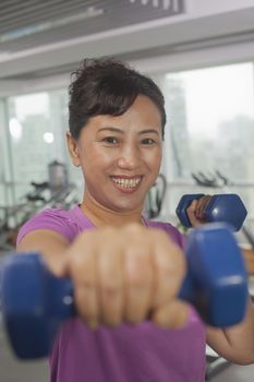 Woman exercising with weights