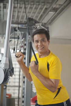 Mature man working out in the gym, portrait 