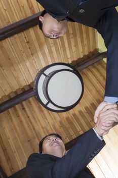 Low Angle View of Businessmen Shaking Hands