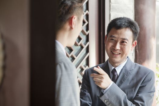 Businessmen in Doorway