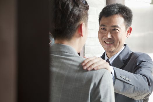 Businessmen in Doorway