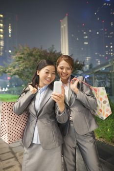 Young businesswomen taking self-portrait with Cell Phone