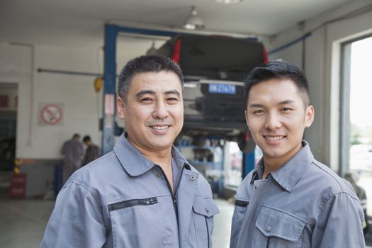 Portrait of Two Garage Mechanics