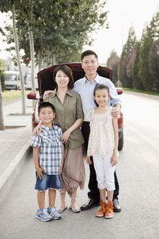 Family Portrait in Front of Car on Roadside
