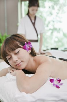 Women Receiving Hot Stone Massage