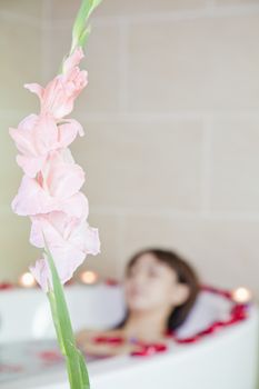 Young Woman Bathing at Health Spa