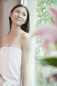 Young Woman Looking out of Spa Window