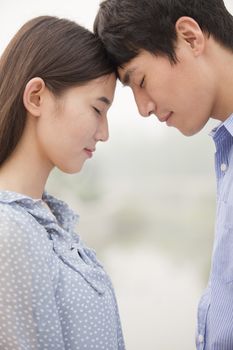 Young Couple Touching Foreheads