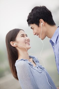 Young Couple Listening to Music Together