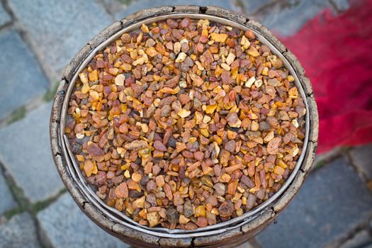 photo of old barrel filled with amber