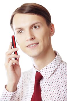 Smiling businessman talking via cell phone on a white background