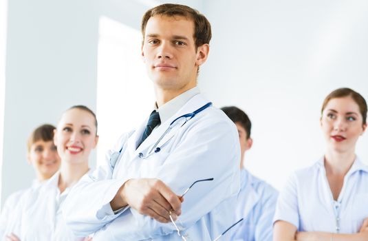 team of experienced highly qualified doctors, fold one's arms