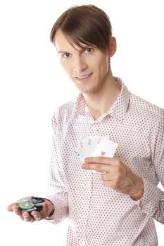 Smiling man holding poker cards and chips on a white background