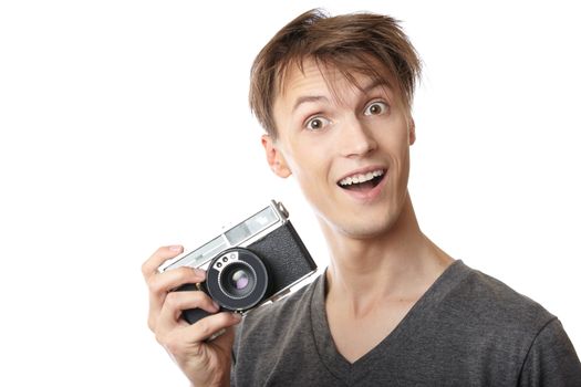 Young photographer holding vintage film photo camera