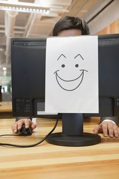 Smiley Face on the Computer in the Office