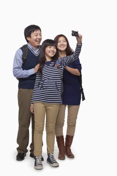 Family taking picture with digital camera