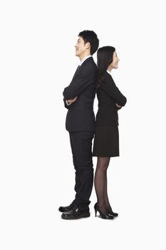 Businessman and businesswomen standing back to back