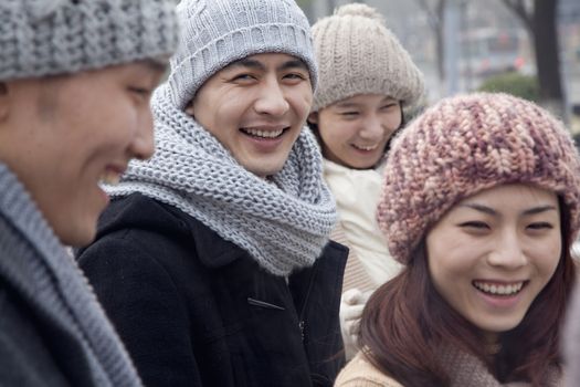 Group of Friends Playing Outdoors at Winter