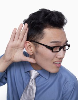 Businessman Holding Hand Up to Ear