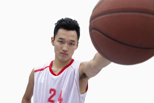 Basketball Player Holding Out Basketball