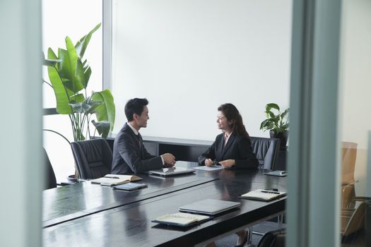 Co-workers in meeting room