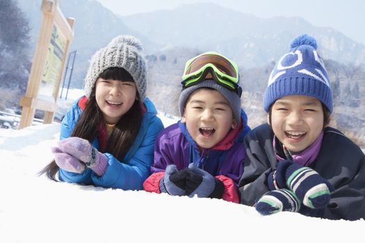 Children Lying on the Snow