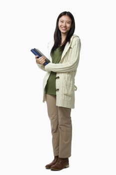 Smiling female student carrying books, portrait