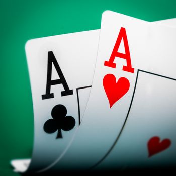 two aces on a green table casino