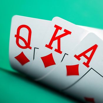 playing cards on a green table casino