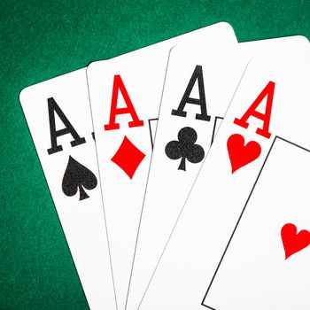 Four aces on a green table casino