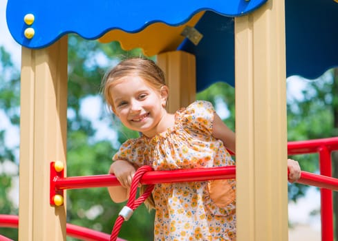 cute beautiful little girl on the playground