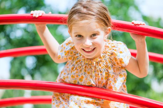 cute little girl on the kids playground