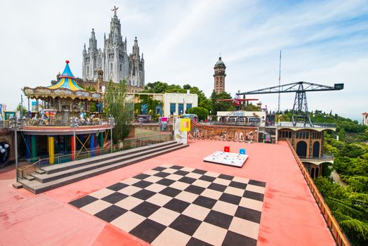 BARCELONA - JUNE 07: Amusement Park on Mount Tibidabo on June 07, 2013 in Barcelona, Spain. It has an area of ??70,000 m2 and is the oldest amusement park in Spain