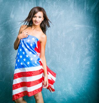 fashion girls with usa flag against textured wall