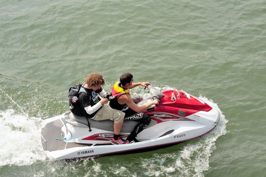 Ales - France - on July 14th, 2013 - Championship of France of Jet Ski on the river Gardon. Photographer on jet ski