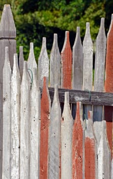 Old weathered wooden picket fence