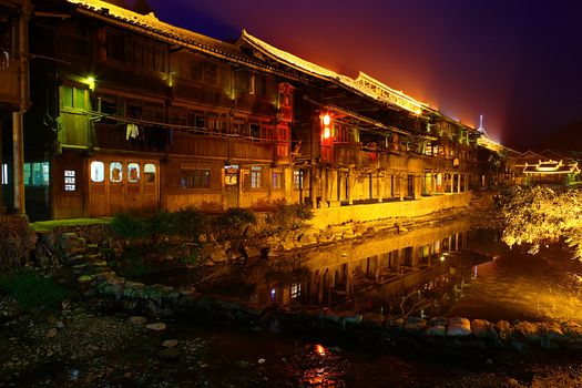 Zhaoxing Dong Village (Zhao Xing Dong Zhai) in Southeast Guizhou Miao and Dong Nationalities Autonomous Prefecture of southwest China is one of the largest ethnic Dong Minority towns in the region. It is surrounded by mountains at all sides and this is the main geographic feature. A river is flowing through the village center. 