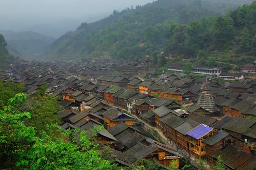 Zhaoxing Dong Village (Zhao Xing Dong Zhai) in Southeast Guizhou Miao and Dong Nationalities Autonomous Prefecture of southwest China is one of the largest ethnic Dong Minority towns in the region. It is surrounded by mountains at all sides and this is the main geographic feature. A river is flowing through the village center. 