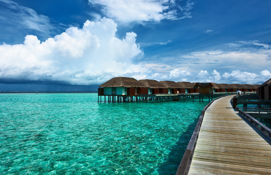 Beautiful beach with water bungalows at Maldives