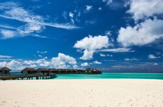 Beautiful beach with water bungalows at Maldives