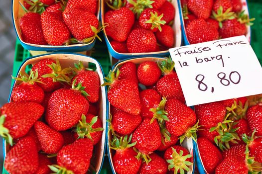 Baskets of fresh strawberries at street market